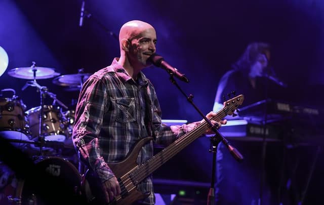 A guitarist performing on the Branson Meadows stage